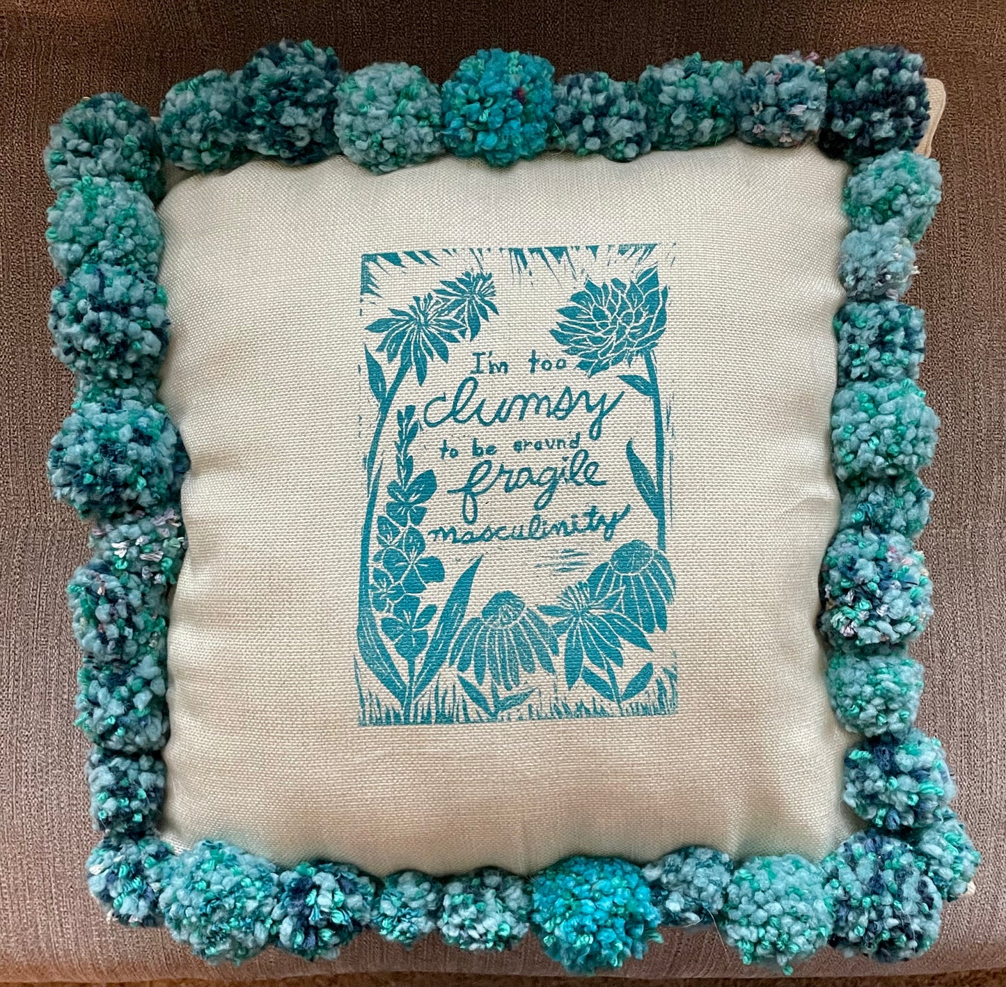 Fragile Masculinity Hand-Printed Teal Pillow with Handmade Pom-Poms