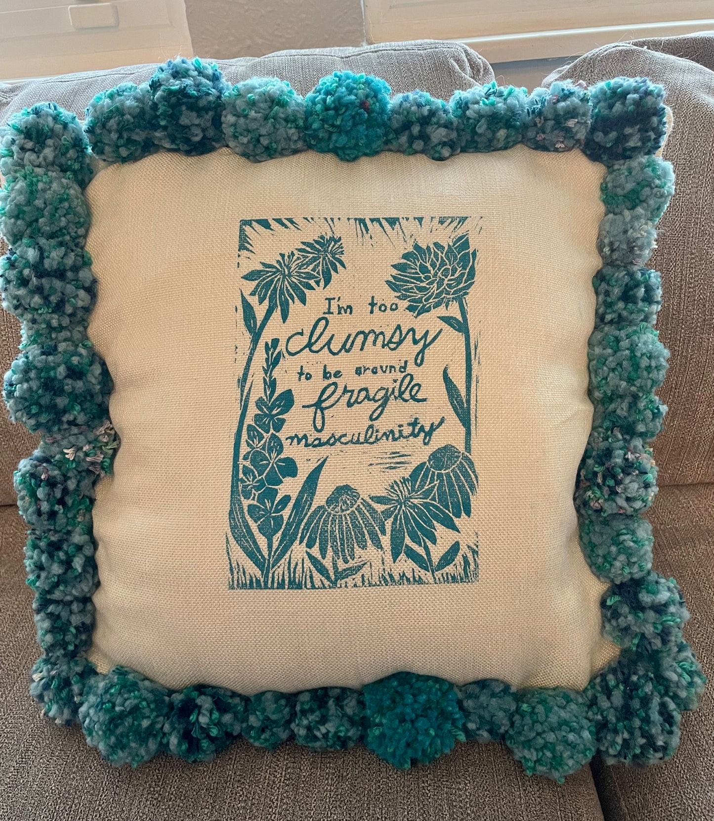 Fragile Masculinity Hand-Printed Teal Pillow with Handmade Pom-Poms