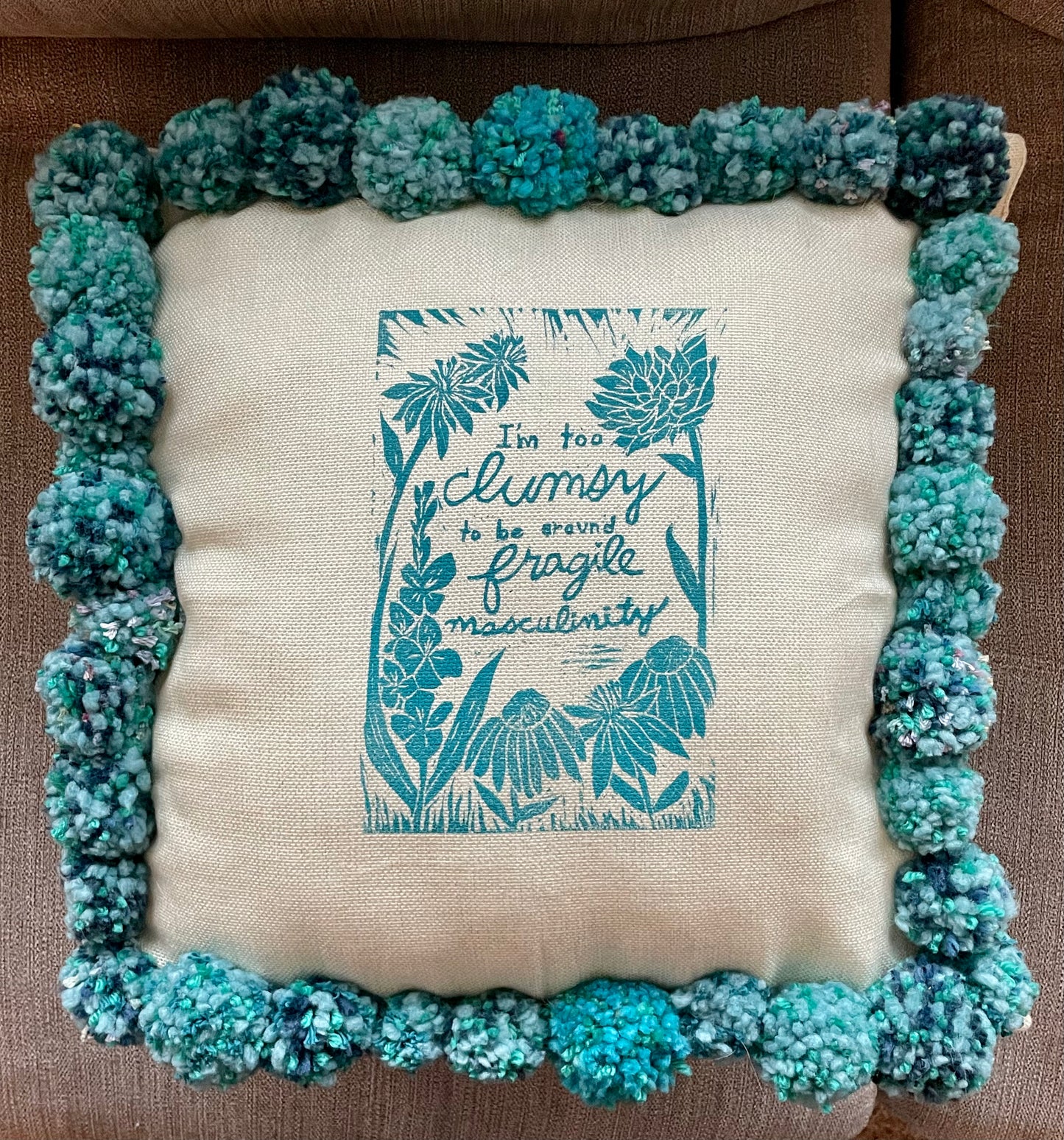 Fragile Masculinity Hand-Printed Teal Pillow with Handmade Pom-Poms