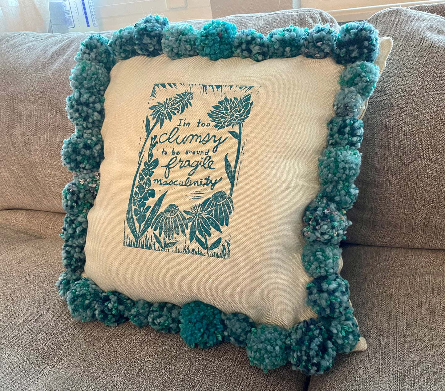 Fragile Masculinity Hand-Printed Teal Pillow with Handmade Pom-Poms