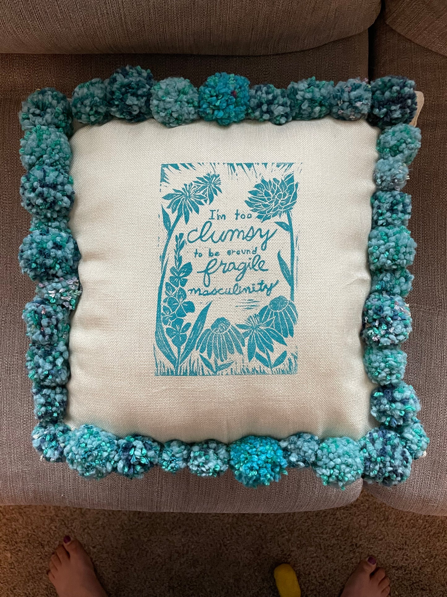 Fragile Masculinity Hand-Printed Teal Pillow with Handmade Pom-Poms
